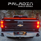 Chevy Silverado 2014–2018 with PSM PALADIN LED tailgate protector. Close up rear view shot with brake lights activated.