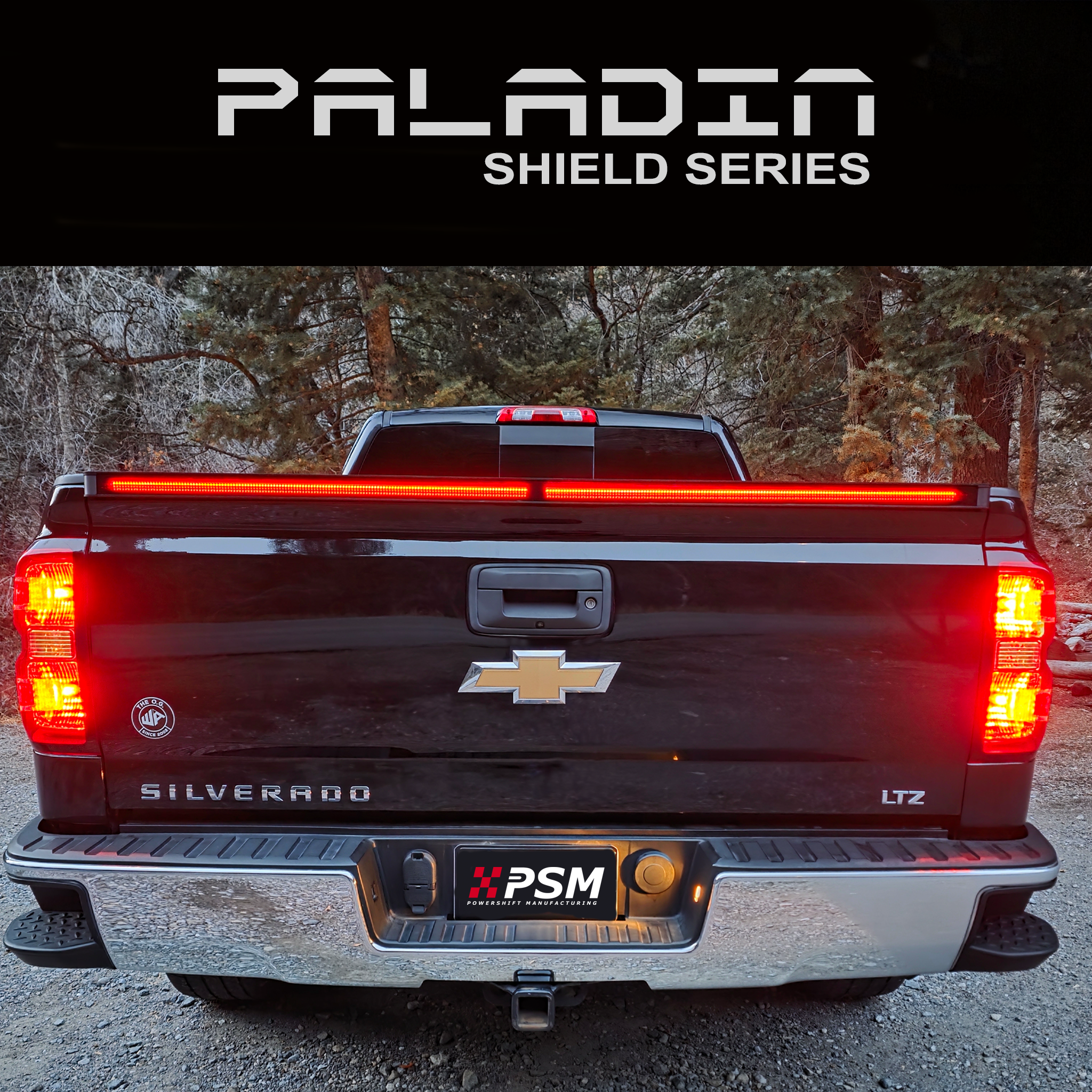 Chevy Silverado 2014–2018 with PSM PALADIN LED tailgate protector. Close up rear view shot with brake lights activated.