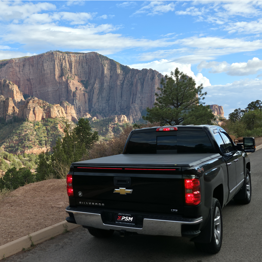 Chevy Silverado 2014–2018 with PSM PALADIN LED tailgate protector from the Shield series with the recon light bar.